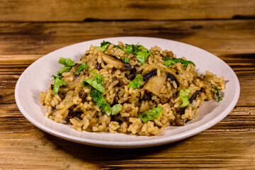 Risotto with mushrooms and paesley in a plate