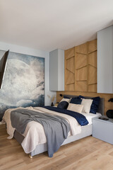 Comfortable and stylish bedroom with wooden wall