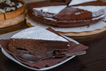 Fototapeta na wymiar A slice of chocolate cake on a plate