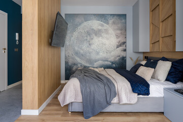 Bedroom with wooden wall and moon wallpaper