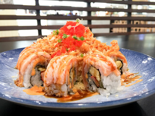 Salmon roll japanese food in blue plate