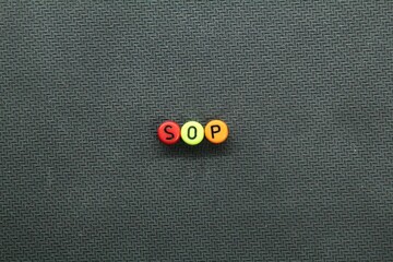 round letters colored SOP or Standard Operating Procedure