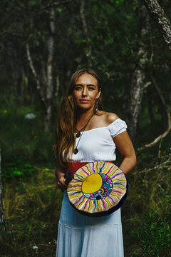 Woman Holding Shaman Drum With Drumstick