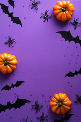 Happy Halloween holiday party poster with pumpkins, bats, spider on purple background. Flat lay,...