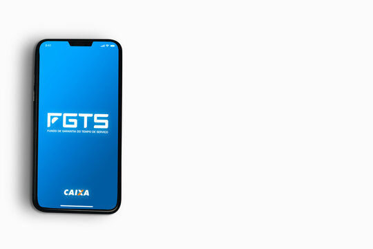 FGTS da Caixa app on smartphone screen on white background. Brazilian worker guarantee fund. Top view. Rio de Janeiro, RJ, Brazil. May 2021.