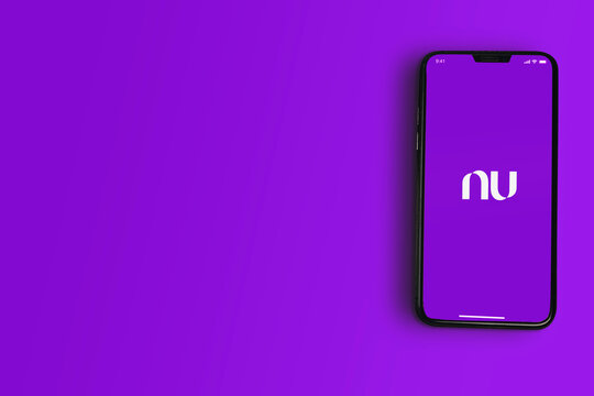 Banco Nubank (Nu bank Digital) app on smartphone screen on purple background. Rio de Janeiro, RJ, Brazil. May 2021.