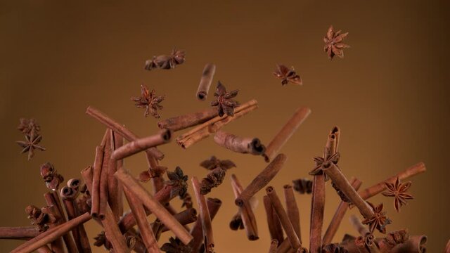 Super slow motion of flying whole cinnamon barks, star anise and clove. Filmed on high speed cinema camera, 1000 fps