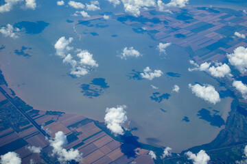 sky and clouds from the airplane window from above © Levashin
