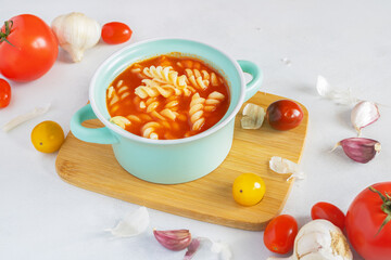 Tomato soup with pasta. Soup in a pot. Homemade tomato soup. Traditional Polish cuisine. Fresh...