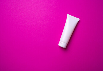 packaging of hand or face cream on pink background