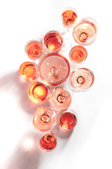 Rose wine of different shades in glasses on white background. Rosado, rosato or blush wines tasting