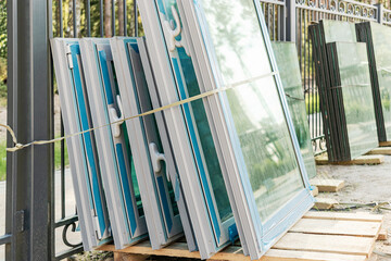 New sealed glass units at building site. Storage and preparation at the installation of windows.