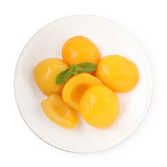 Halves of canned peaches with mint leaves isolated on white, top view
