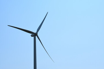 wind turbine against sky green energy