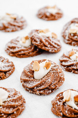 Chocolate brown cookies with nuts isolated on white background. Close-up. Space for text. High quality photo