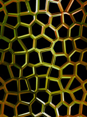 Gold, metal net on a black background. Yellow texture on a dark background.
