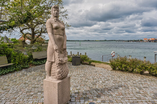 Kerteminde statue of traditional Amanda fishing wonan, Denmark