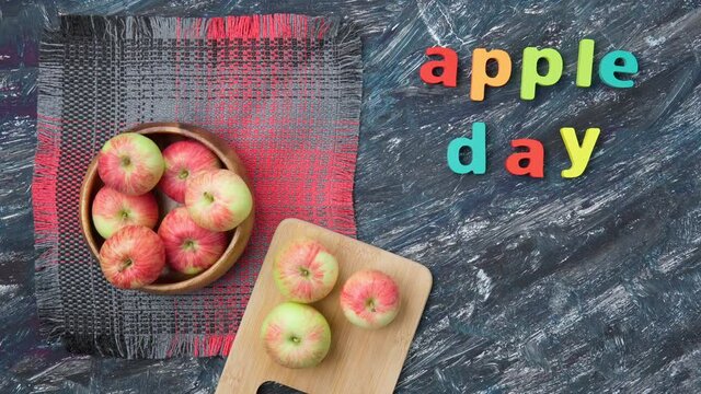 Apple holiday on October 21. Red apples on a dark background. Top view