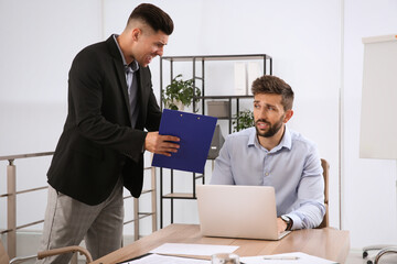 Boss screaming at employee in office. Toxic work environment