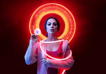 Beautiful woman in futuristic costume on dark background. Augmented reality, future technology, AI concept. Holographic interface to display data. Red neon light.