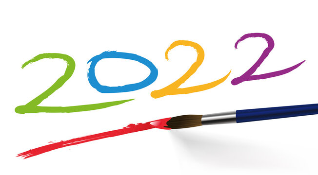 Concept artistique pour une carte de voeux, avec l’année 2022 écrite de différente couleurs avec un pinceau, sur un fond blanc.