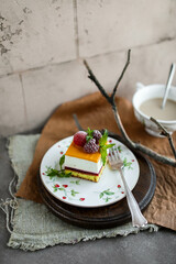 Mousse cake with lemon, raspberry filling and sea buckthorn cream. Summer desserts with seasonal berries.