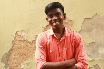 Portrait of a young Indian smiling man  - obrazy, fototapety, plakaty