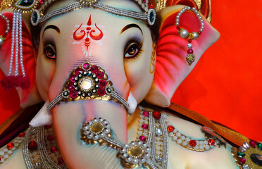 Indian Hindu God Ganesha idol, made out of plaster of paris, during ganesh Chathurthi festival, to offer prayers