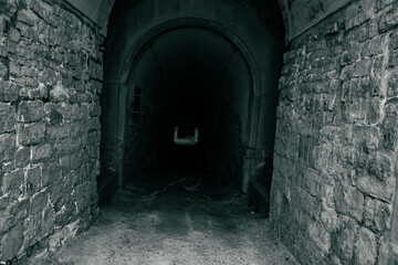 Obraz premium a corridor in the dark of an ancient fortress