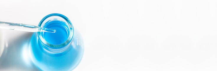 blue science experiment glass tube,Pipette of blue liquid and flask. To see more Laboratory images...