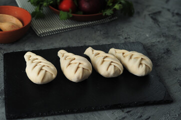  Khinkali on stone background. National georgian food.	