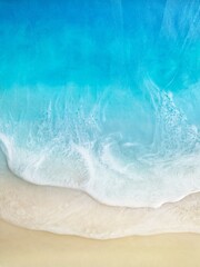 Fototapeta na wymiar Top view of sea and sand, Summer beach background, Ocean waves, white sea foam and Sandy beach