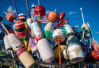 nautical nets and floats piled on the pier