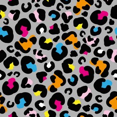 Simple trending leopard pattern. Gray background, colored spots of a leopard. vector texture. The print is suitable for textiles, banners and wallpapers.
