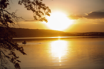 Fototapeta na wymiar Photo of a beautiful landscape of the river at sunset