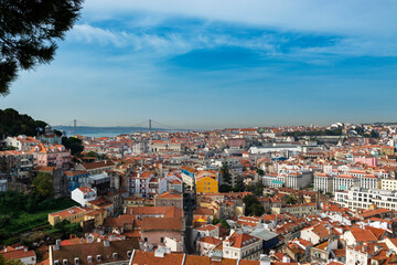 View of the downtown of the city of Lisbon from the Graca Viewpoint (Miradouro da Graca) with the Tagus River on the background, in Portugal