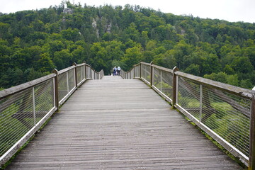 Obraz premium The bridge, also known as the Tatzelwurm, which meanders over the Main-Danube Canal with a length of 193 m, is one of the longest wooden bridges in Europe and is considered a structural masterpiece.