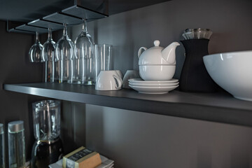 Shelves and storage areas for dishes, glasses and kitchen utensils