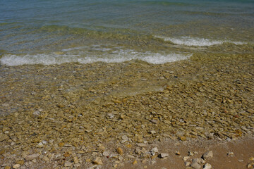 The colorful and clear waters of the straits of Mackinac and the Mackinac Bridge connecting the Upper and Lower Peninsula of Michigan