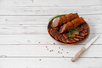Homemade jerked dried meat or biltong with spices on a wooden background. Beer snack concept....