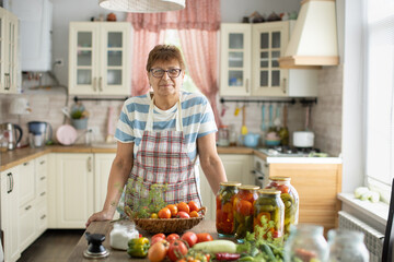 Woman in the kitchen makes pickles