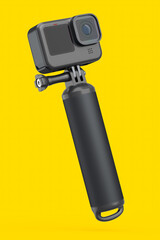Photo and video lightweight action camera with monopod on yellow background