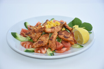 chicken salad with tomato, pepper, cucumber, arugula, corn