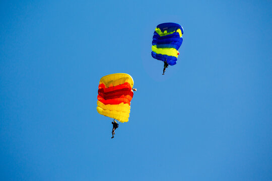 Parachute in the sky. Skydiver is flying a parachute in the blue sky.