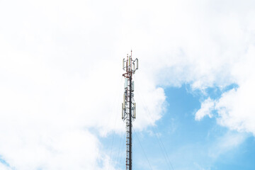 Obraz premium Telecommunication mast TV antennas in the afternoon ,on the hill blue sky with cloud bright at Phuket Thailand.