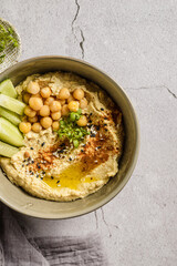 hummus with cucumber and sesame seeds