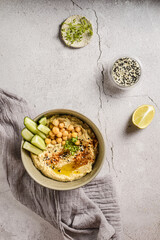 hummus with cucumber and sesame seeds