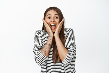 Image of girl scream of surprise and amazement, reaction to big great annoucement, white background