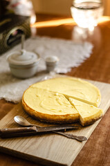 cheesecake on a wooden board on the table
