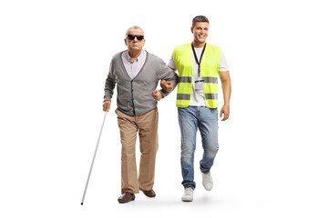 Full length portrait of a community worker helping a blind man